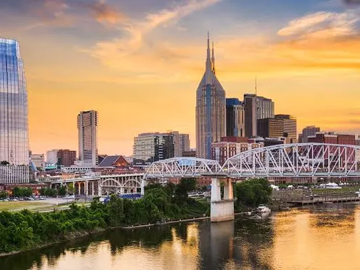 Nashville skyline and pedestrian bridge at sunset